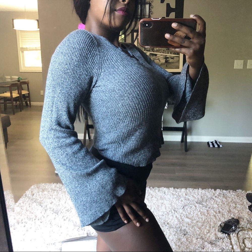 Cute strappy sweater!